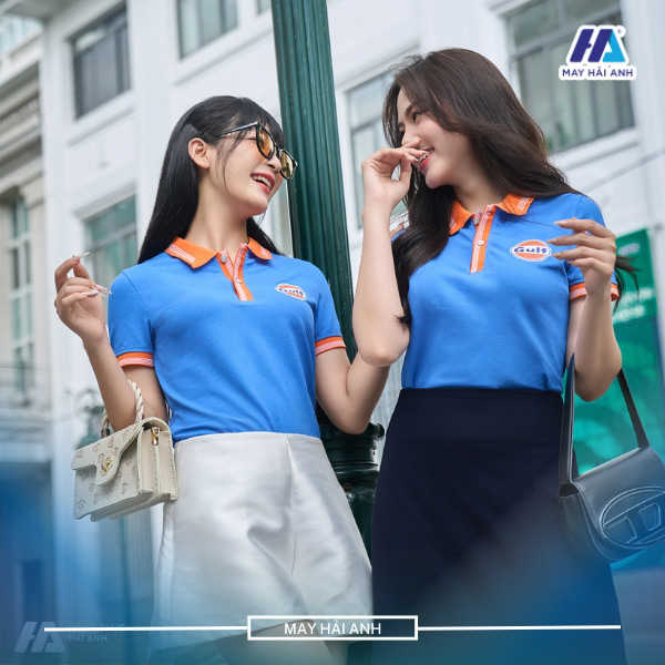 Blue uniform shirt with orange collar and sleeves